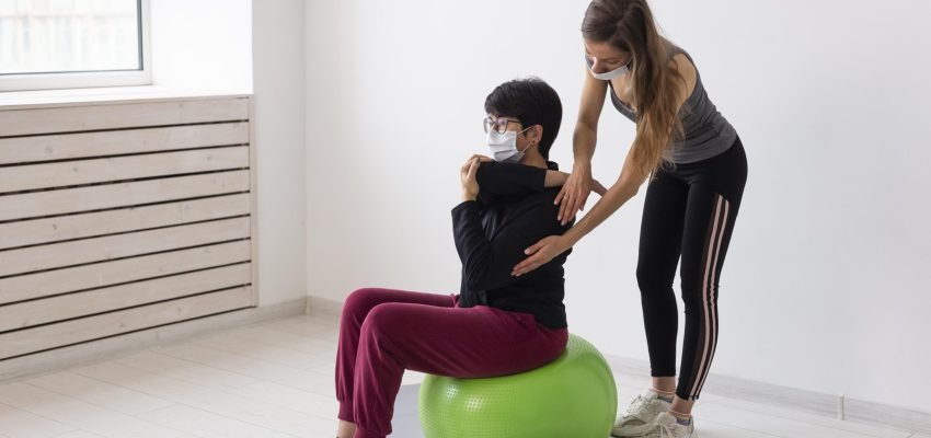 woman-with-glasses-recovering-after-having-covid-fitness-ball